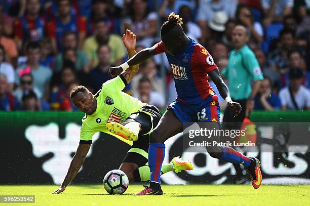 Callum Wilson of AFC Bournemouth battles with Pape Souare of Crystal Palace during the Premier League match between Crystal Palace and AFC...