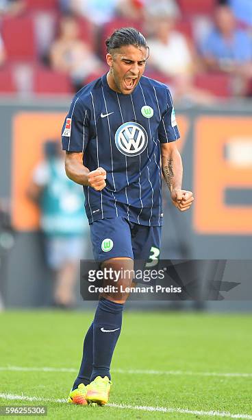 Ricardo Rodriguez of VfL Wolfsburg celebrates his team's second goal during the Bundesliga match between FC Augsburg and VfL Wolfsburg at WWK Arena...