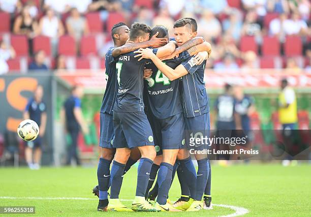 The team of VfL Wolfsburg celebrates it's second goal during the Bundesliga match between FC Augsburg and VfL Wolfsburg at WWK Arena on August 27,...