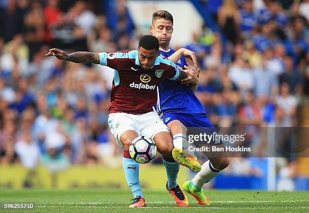 Andre Gray of Burnley holds off Gary Cahill of Chelsea during the Premier League match between Chelsea and Burnley at Stamford Bridge on August 27,...