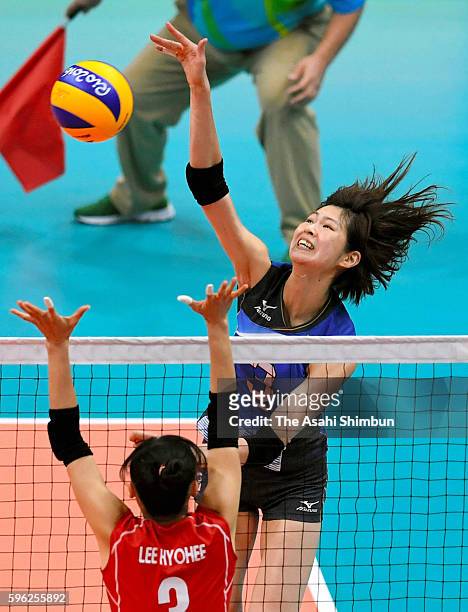 Saori Kimura of Japan spikes the ball against Korea during the Women's Preliminary Pool A match between Japan and Korea on Day 1 of the Rio de...