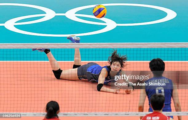 Saori Kimura of Japan dives for the ball during the Women's Preliminary Pool A match between Japan and Korea on Day 1 of the Rio de Janeiro Olympic...