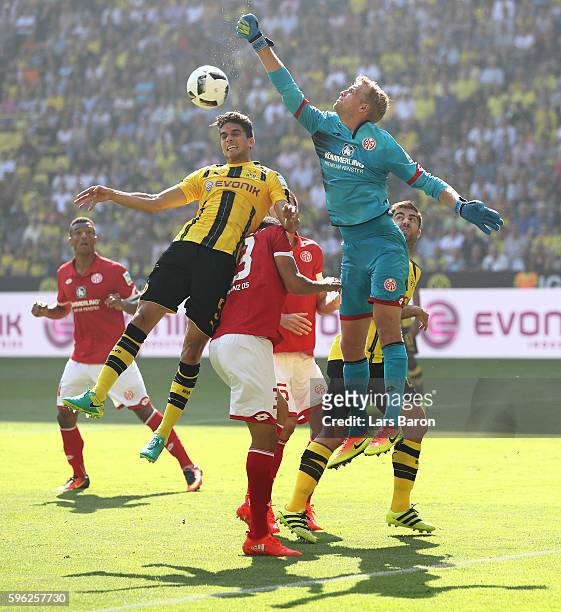 Marc Bartra of Dortmund goes up for a header with Jonas Loessl of Mainz during the Bundesliga match between Borussia Dortmund and 1. FSV Mainz 05 at...