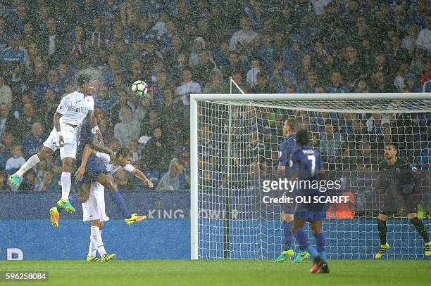 Swansea City's Dutch midfielder Leroy Fer scores from a header during the English Premier League football match between Leicester City and Swansea...