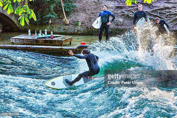 surfing on the englischer garten (english garden ) - eisbach river stock pictures, royalty-free photos & images