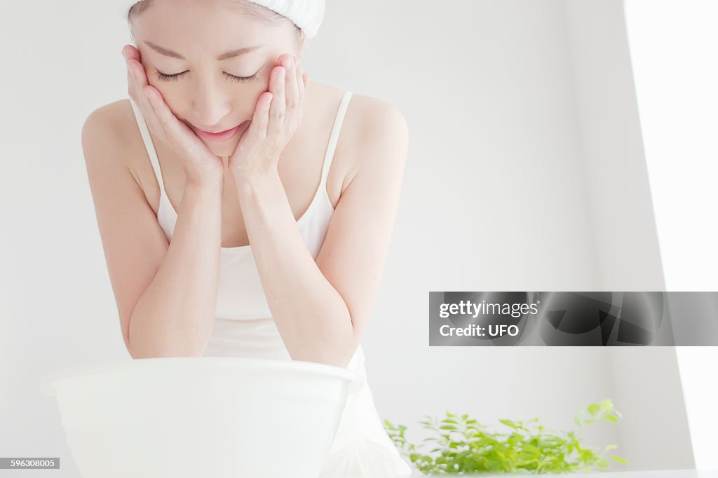 Woman washing face