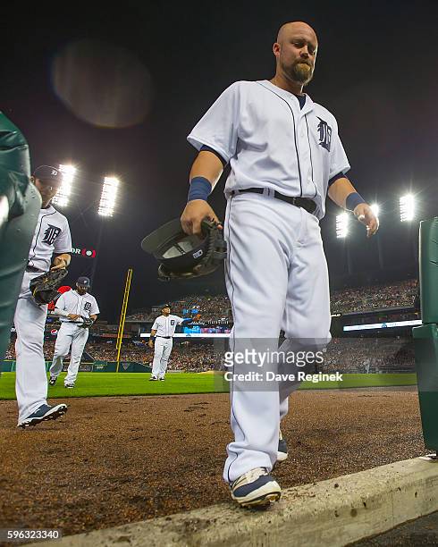 Casey McGehee of the Detroit Tigers heads to the dugout in the third inning during a MLB game against the Boston Red Sox at Comerica Park on August...