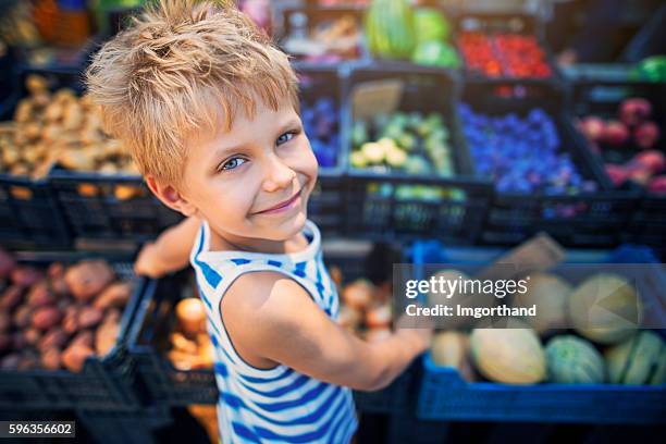 little boy at the italian farmer's market - custom fit stockfoto's en -beelden