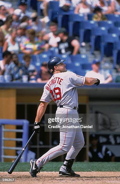 Dante Bichette of the Boston Red Sox at bat during the game against the Chicago White Sox at Comiskey Park in Chicago, Illinois. The White Sox...