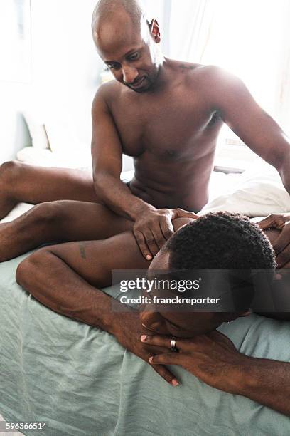 homosexual couple relaxing togetherness and sharing a massage - tantra massage 個照片及圖片檔