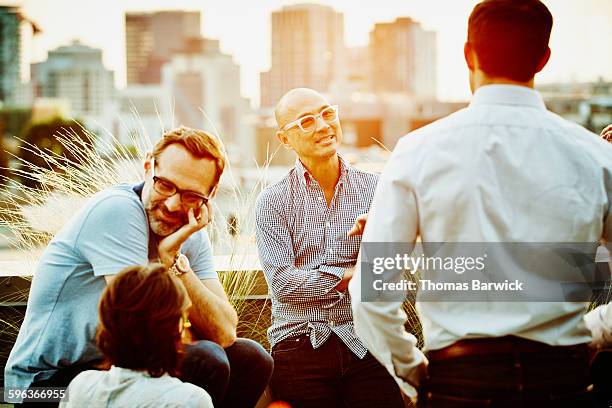 colleagues in discussion on office terrace - lady 30s wearing glasses stock pictures, royalty-free photos & images