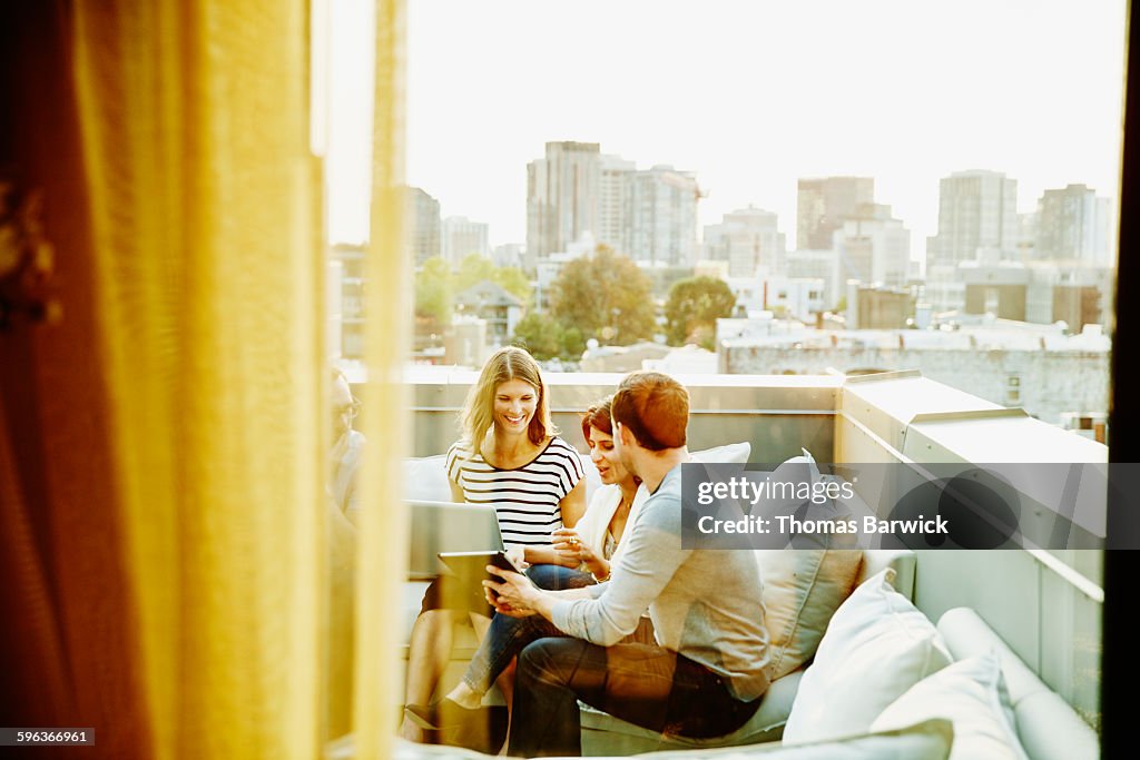 Businesswoman discussing project with coworkers