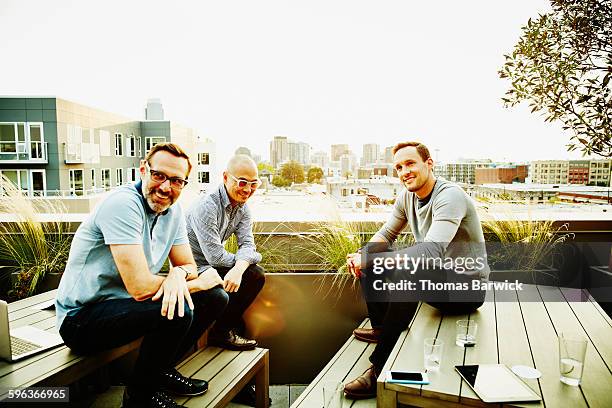 colleagues on office terrace having meeting - 2015 45 50 stock pictures, royalty-free photos & images