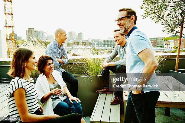 colleagues having meeting on office terrace - 2015 45 50 stock pictures, royalty-free photos & images