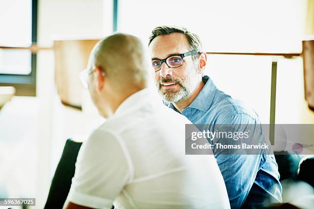 business colleagues having informal meeting - 2015 45 50 stock pictures, royalty-free photos & images
