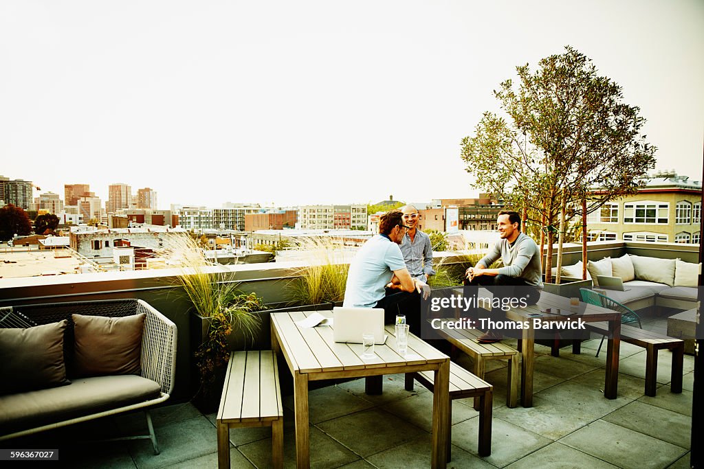 Colleagues having meeting on office terrace