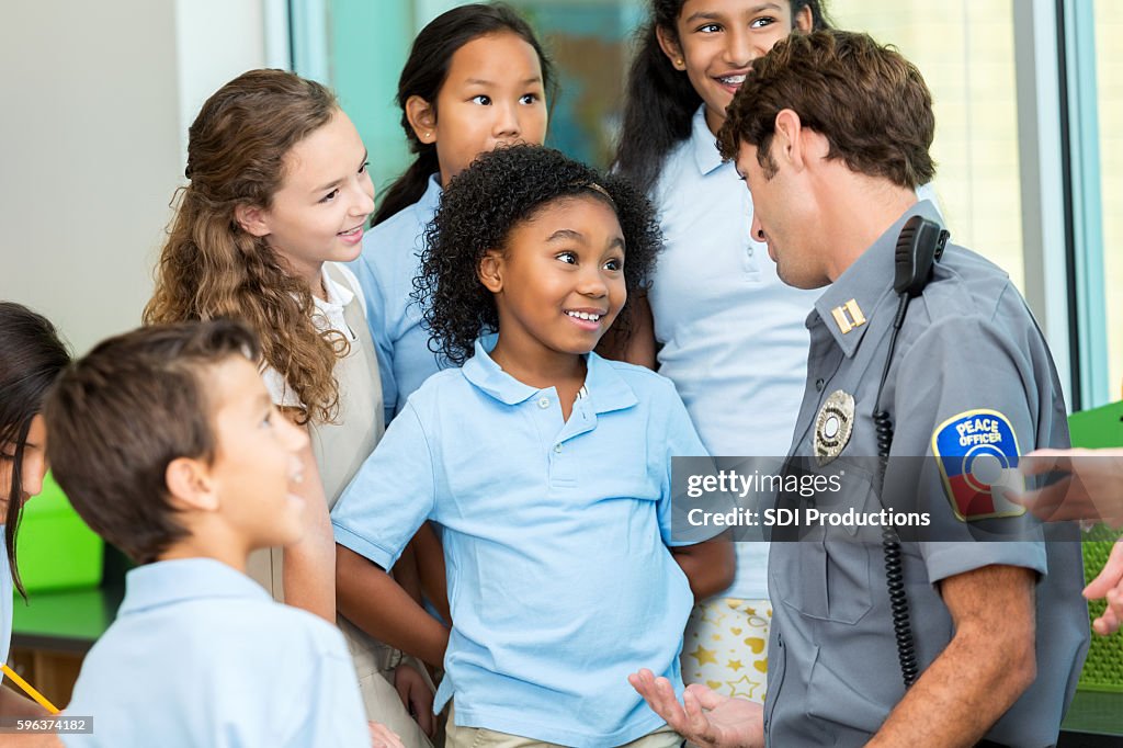 Elementary school student asks policeman a question