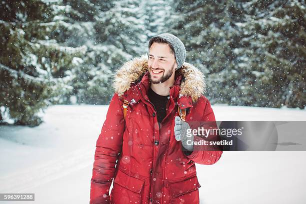 enjoying a solitary walk - man snow stock pictures, royalty-free photos & images