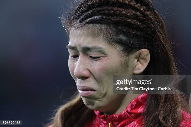 Day 13 A distraught Saori Yoshida of Japan after losing to Helen Louise Maroulis of the United States in the Women's Freestyle 53 kg Final match at...