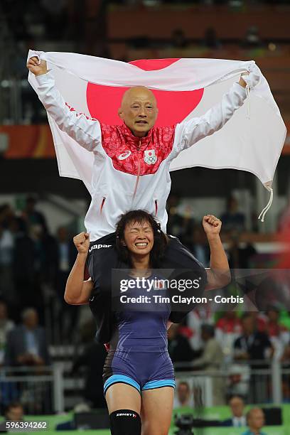 Day 13 Risako Kawai of Japan celebrates her gold medal victory with her coach, Kazuhito Sakae of Japan after her gold medal victory against Maryia...