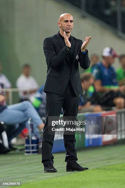 Coach Andre Schubert of Moenchengladbach applauds during the UEFA Champions League Qualifying Play-Offs Round: Second Leg between Borussia...