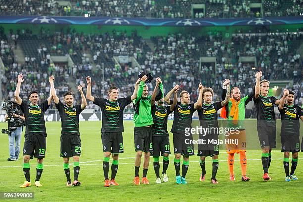 Players of Moenchengladbach celebrate after winning 6-1 in the UEFA Champions League Qualifying Play-Offs Round: Second Leg between Borussia...