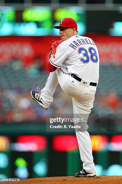 Lucas Harrell of the Texas Rangers throws in the first inning against the Oakland Athletics at Globe Life Park in Arlington on August 16, 2016 in...