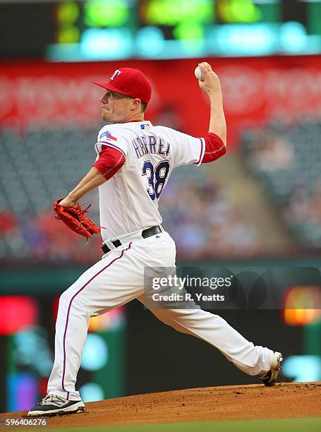 Lucas Harrell of the Texas Rangers throws in the first inning against the Oakland Athletics at Globe Life Park in Arlington on August 16, 2016 in...
