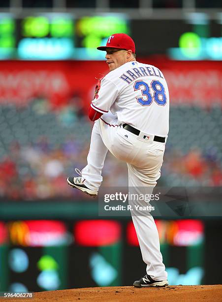 Lucas Harrell of the Texas Rangers throws in the first inning against the Oakland Athletics at Globe Life Park in Arlington on August 16, 2016 in...