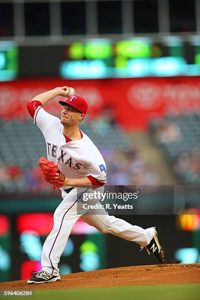 Lucas Harrell of the Texas Rangers throws in the first inning against the Oakland Athletics at Globe Life Park in Arlington on August 16, 2016 in...