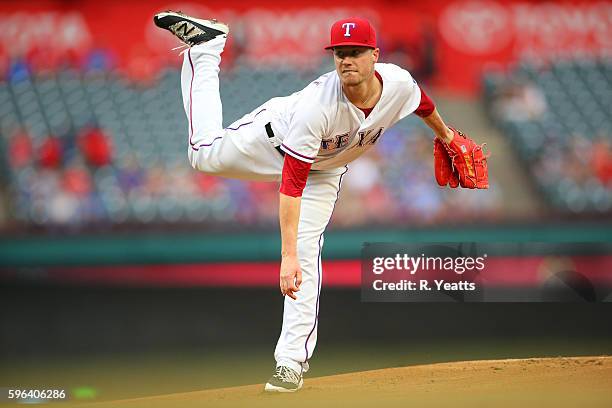 Lucas Harrell of the Texas Rangers throws in the first inning against the Oakland Athletics at Globe Life Park in Arlington on August 16, 2016 in...