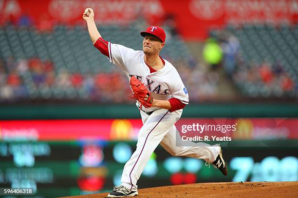 Lucas Harrell of the Texas Rangers throws in the first inning against the Oakland Athletics at Globe Life Park in Arlington on August 16, 2016 in...