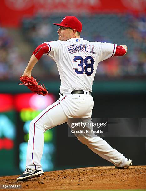 Lucas Harrell of the Texas Rangers throws in the first inning against the Oakland Athletics at Globe Life Park in Arlington on August 16, 2016 in...