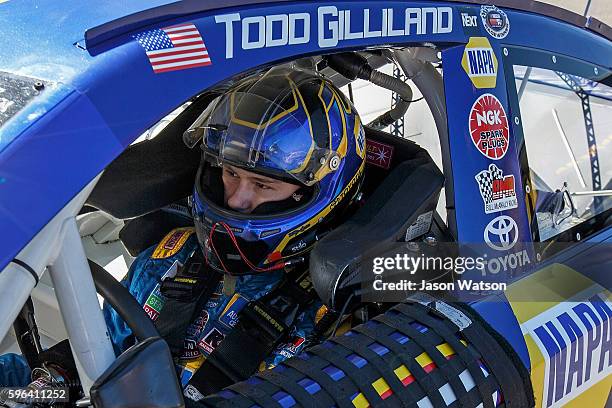 Todd Gilliland driver of the NAPA Auto Parts Toyota sits in his car during practice for the NASCAR K&N Pro Series West Toyota/NAPA Auto Parts 150 at...