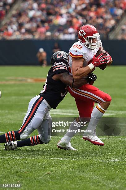 Brian Parker of the Kansas City Chiefs is brought down by Jerrell Freeman of the Chicago Bears during a preseason game at Soldier Field on August 27,...