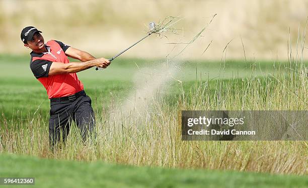 Jason Day of Australia hits a shot on the 11th hole during the third round of The Barclays in the PGA Tour FedExCup Play-Offs on the Black Course at...