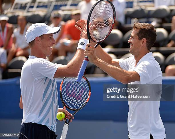 Henri Kontinen of Finland, left, and Guillermo Garcia-Lopez of Spain celebrate after the final point of their win over Andre Begemann of Germany and...