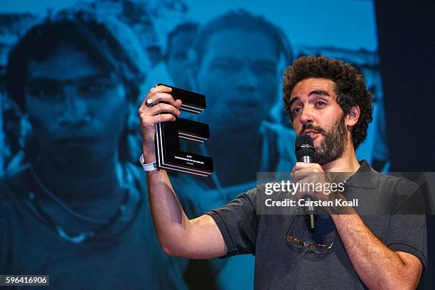 Zacharie Rabehi, Photographer of the Year 2016 after he won the prize during the award ceremony of the EyeEm photofestival at Heimathafen Neukoelln...