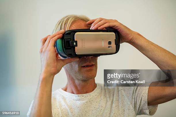 Richard Newstead of Getty Images stays on the stand during the EyeEm photofestival at Heimathafen Neukoelln on August 27, 2016 in Berlin, Germany.
