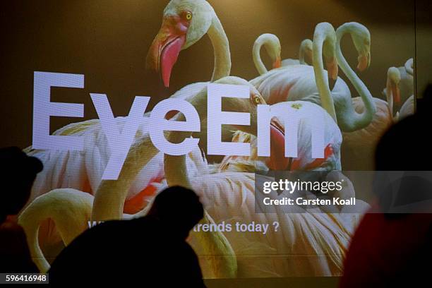 Visitors attend the EyeEm photofestival at Heimathafen Neukoelln on August 27, 2016 in Berlin, Germany.