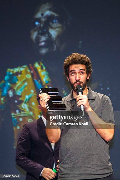 Zacharie Rabehi, Photographer of the Year 2016 after he won the prize during the award ceremony of the EyeEm photofestival at Heimathafen Neukoelln...