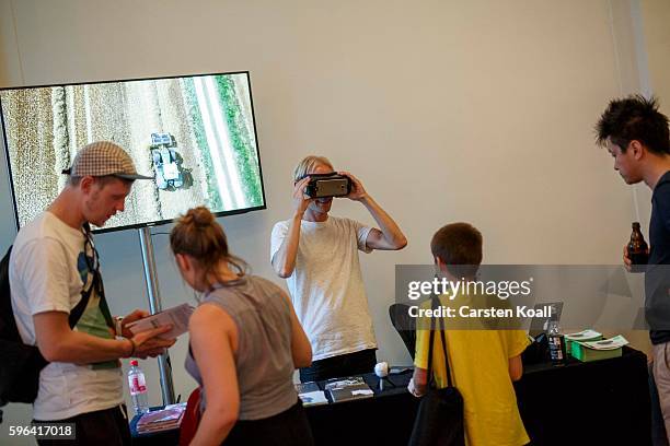 Richard Newstead of Getty Images stays on the stand during the EyeEm photofestival at Heimathafen Neukoelln on August 27, 2016 in Berlin, Germany.