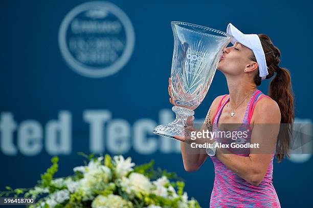 Agnieszka Radwanska of Poland holds her trophy after defeating Elina Svitolina of Ukraine in the women's singles final on day 7 of the Connecticut...