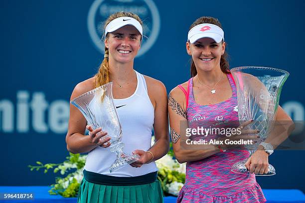 Agnieszka Radwanska of Poland and Elina Svitolina of Ukraine pose for a picture after their women's singles final on day 7 of the Connecticut Open at...