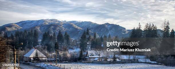 transylvanian alps and small village in winter - alps romania stock pictures, royalty-free photos & images