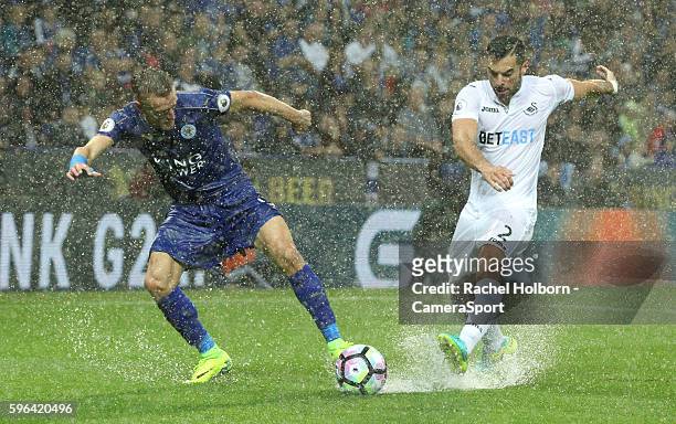 Leicester City's Jamie Vardy and Swansea City's Jordi Amat in action during the Premier League match between Leicester City and Swansea City at The...