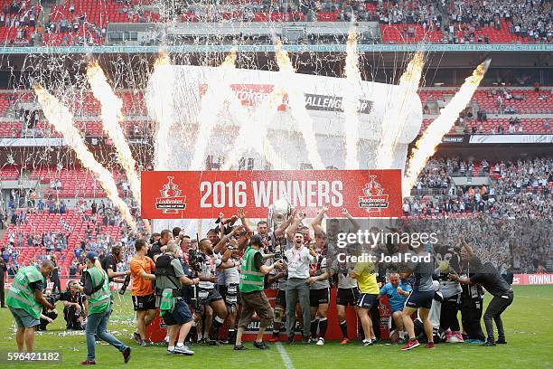 Hull FC celebrate after winning the Ladbrokes Challenge Cup Final between Hull FC and Warrington Wolves at Wembley Stadium on August 27, 2016 in...