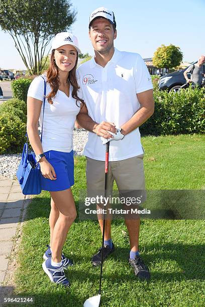 Former football player Michael Ballack and his girlfriend Natacha Tannous attend the GRK Golf Charity Masters on August 27, 2016 in Leipzig, Germany.