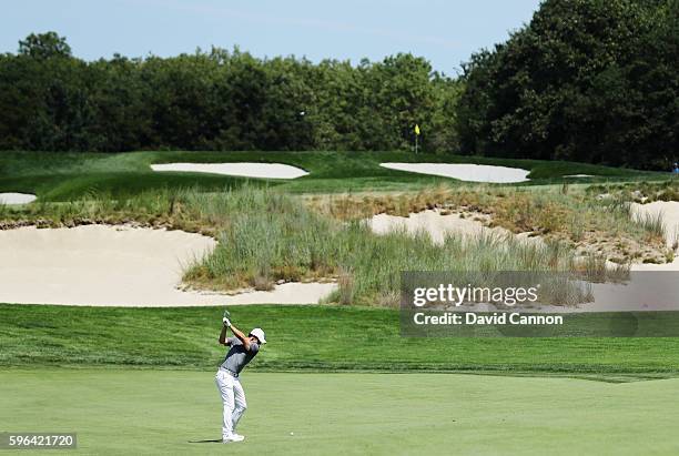 Rory McIlroy of Northern Ireland hits his second shot on the fourth hole during the third round of The Barclays in the PGA Tour FedExCup Play-Offs on...