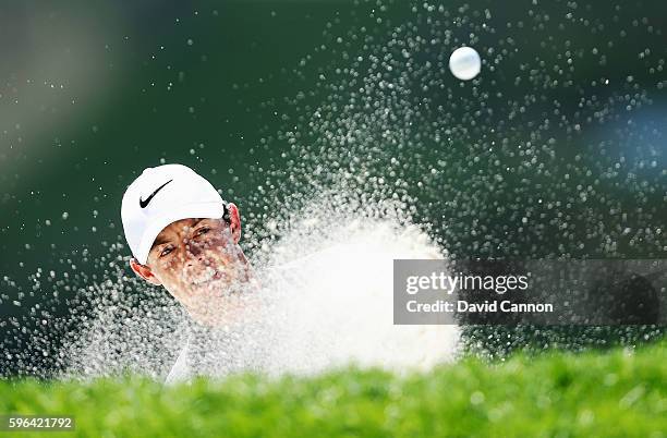 Rory McIlroy of Northern Ireland hits his fourth shot from a bunker on the fourth hole during the third round of The Barclays in the PGA Tour...